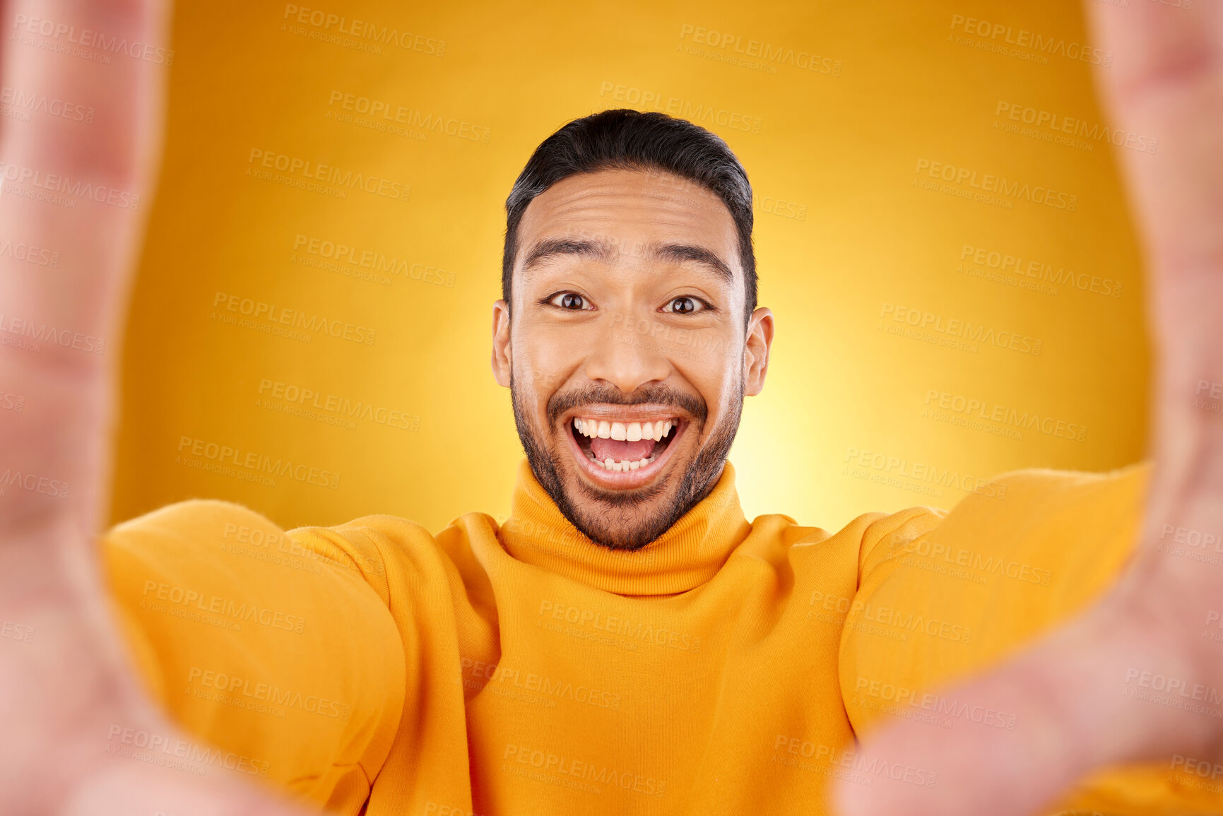 Buy stock photo Excited, portrait and selfie of man in studio isolated on a yellow background. Face, smile and Asian person taking profile picture for happy memory, funny or influencer laughing for social media post