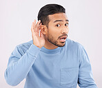 Ear, hands and portrait of asian man with listen, whisper or hearing secret, gossip or news on studio grey background. Confused, what and guy face with emoji sign for deaf, speak up or volume gesture