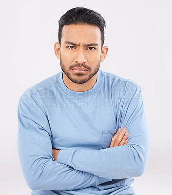 Buy stock photo Portrait, angry and man with arms crossed, frustrated and upset guy against a white studio background. Face, male person and model with anger, expression and frustration with emotion and conflict