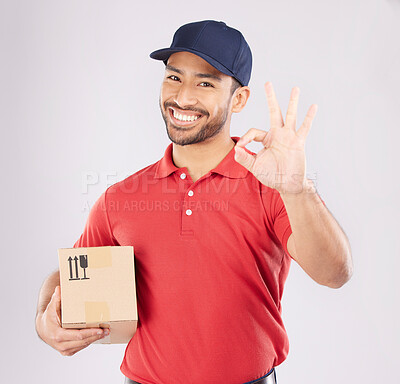 Buy stock photo Courier man, ok sign and studio portrait with box, delivery, opinion or good service by white background. Supply chain manager, happy or review with like icon, emoji and hand with cardboard package