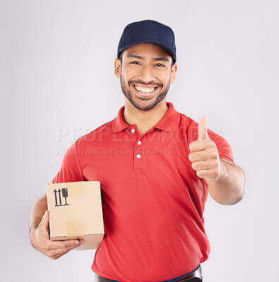 Buy stock photo Courier man, thumbs up and studio portrait with box, delivery company and smile by white background. Supply chain manager, happy and review with icon, emoji or sign language with cardboard package