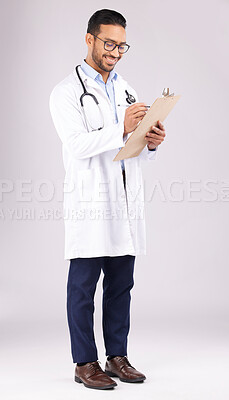 Buy stock photo Happy man, doctor or writing on clipboard in studio, planning documents or medical schedule. Asian healthcare worker with test report of insurance, clinic notes or medicine script on white background