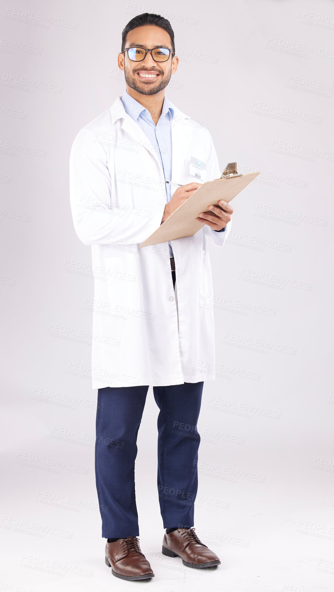 Buy stock photo Portrait, asian man and doctor in studio with clipboard, documents or healthcare administration. Happy medical worker writing report of insurance checklist, test results or script on white background