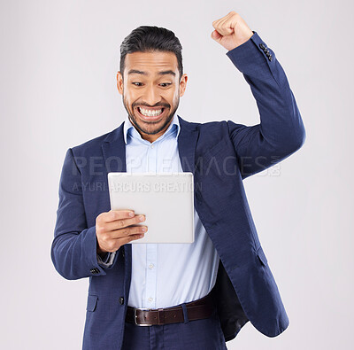 Buy stock photo Happy businessman, tablet and fist pump in celebration for winning, promotion or bonus against a grey studio background. Excited asian man on technology for good news, lottery prize or sale discount