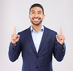 Smile, hand pointing and asian man in studio with sale, announcement or coming soon promo on grey background. Happy, news and Japanese male show launch, platform and giveaway, process or review info