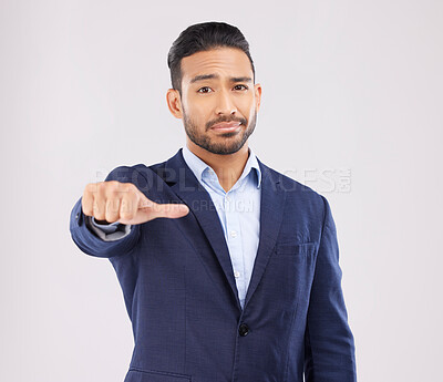 Buy stock photo Review, portrait and a marketing businessman with a hand on a studio background for feedback. Choice, sign language and an Asian employee with a thumb gesture for a decision isolated on a backdrop