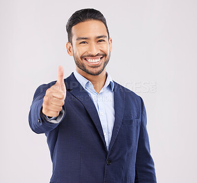 Buy stock photo Happy businessman, portrait and thumbs up for success, approval or winning against a grey studio background. Asian man smile with like emoji, yes sign or good job for business agreement and thank you
