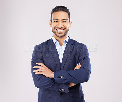 Happy business man, arms crossed and studio portrait with pride, success and suit by white background. Young asian entrepreneur, smile and excited for finance company, corporate fashion and ambition