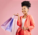 African woman, shopping bag and smile in studio, idea or thinking with sale, deal or discount by pink background. Young gen z girl, happy and gift for fashion, commerce or retail customer experience