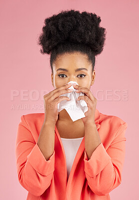 Buy stock photo Woman, tissue and sneeze in studio portrait for healthcare, hygiene and allergy by pink background. African gen z girl, sick student or model with toilet paper, blowing nose or cleaning for self care
