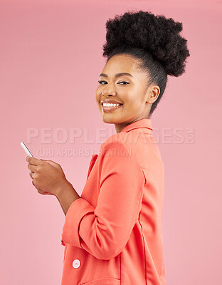 Buy stock photo African woman, studio portrait and phone with texting, web chat or contact with smile by pink background. Young fashion model, student or gen z girl with smartphone, beauty and happy for social media
