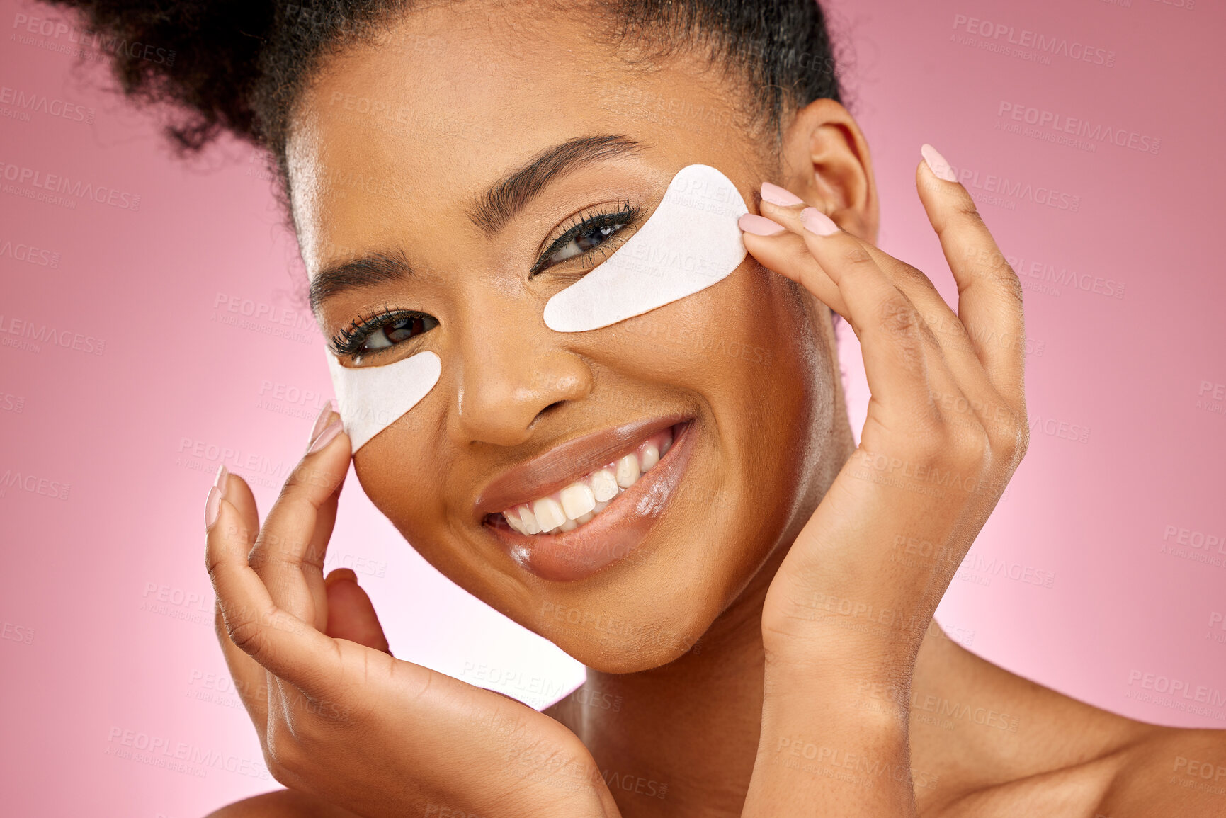 Buy stock photo Woman, smile and eye patch for skincare in studio portrait with beauty, cosmetics or product by pink background. Girl, model and facial self care with hands, natural skin glow or aesthetic for health