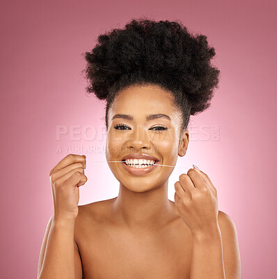 Buy stock photo Black woman, portrait and floss teeth in studio for smile, dental hygiene and care of gum gingivitis on pink background. Happy female model, oral cleaning and thread for fresh breath or healthy habit