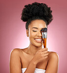 Makeup, smile and black woman with brushes, facial and dermatology against a studio background. Female person, aesthetic and happy model with cosmetic tools, natural beauty and grooming with skincare