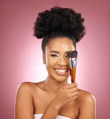 Buy stock photo Portrait, makeup and black woman with brushes, skincare and dermatology against a pink studio background. Female person, aesthetic or model with cosmetic tools, natural beauty or shine with self care