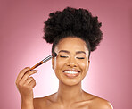 Makeup, smile and black woman with brushes, natural beauty and skincare on a studio background. Female person, aesthetic and happy model with cosmetic tools, grooming and dermatology with self care