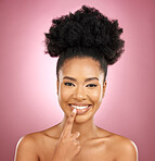 Face, smile and beauty portrait of a woman for skincare, wellness and dermatology glow. Happy, lips and natural cosmetics of a black female model with facial shine on a pink background in studio