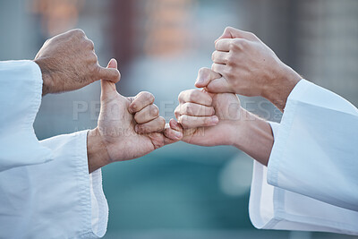 Buy stock photo Hands, karate and grip with sports people fighting outdoor in a competition, battle or combat. Fitness, self defense and thumb war with athletes wrestling while training for martial arts together