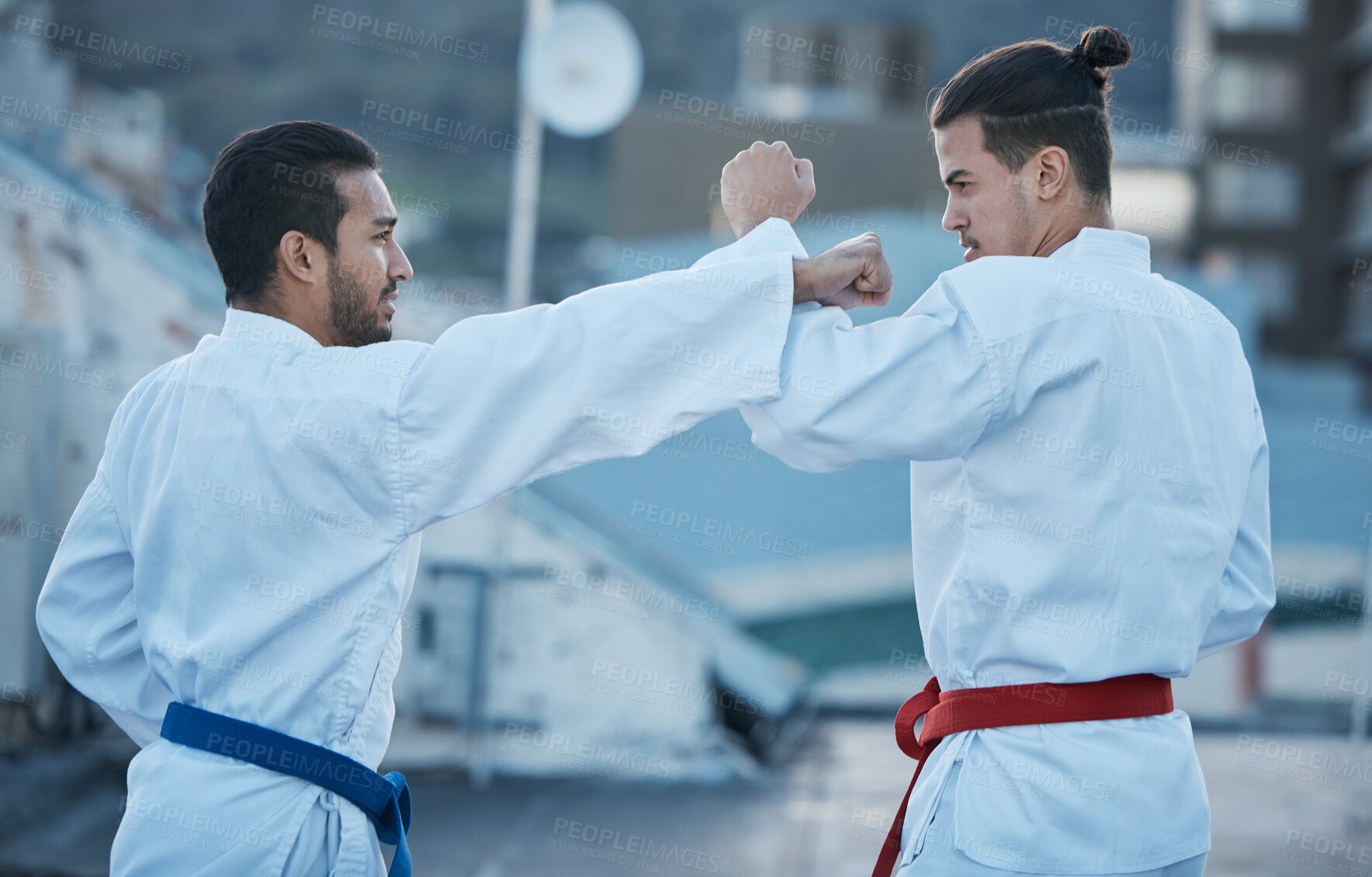 Buy stock photo Men, fight and punch in karate class, training and speed with sparring partner, workout and morning for development. Martial arts team, contest and fitness with mma exercise, coaching or sports