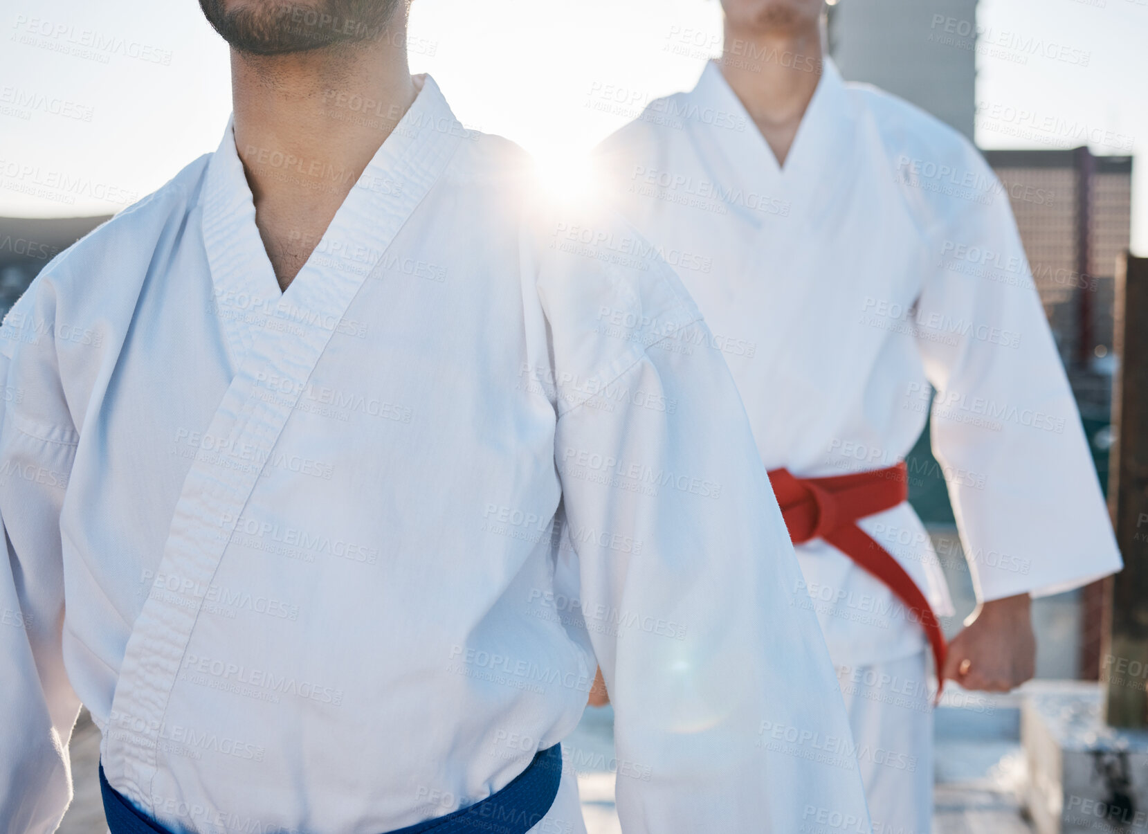 Buy stock photo Karate, gi and men in city for training, workout and start exercise with lens flare. Martial arts, sport and people in competition for taekwondo, battle or fight challenge for healthy body in fitness