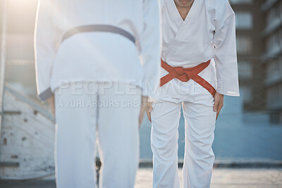 Karate, bow and men outdoor for training, workout and start exercise in city. Martial arts, sports and people in competition for taekwondo, battle and challenge to fight for healthy body in fitness