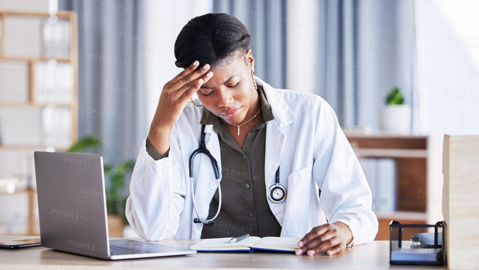 Buy stock photo Doctor, African woman and headache with laptop at desk, clinic office or stress with thinking at job. Overworked medic, fatigue and burnout in hospital, book or anxiety for mental health by computer