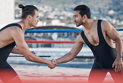 Men, handshake and fight sport in ring, respect or fitness in challenge, battle and gym on roof in cbd. Shaking hands, wrestling coach or friends for contest, exercise or martial arts in Cape Town