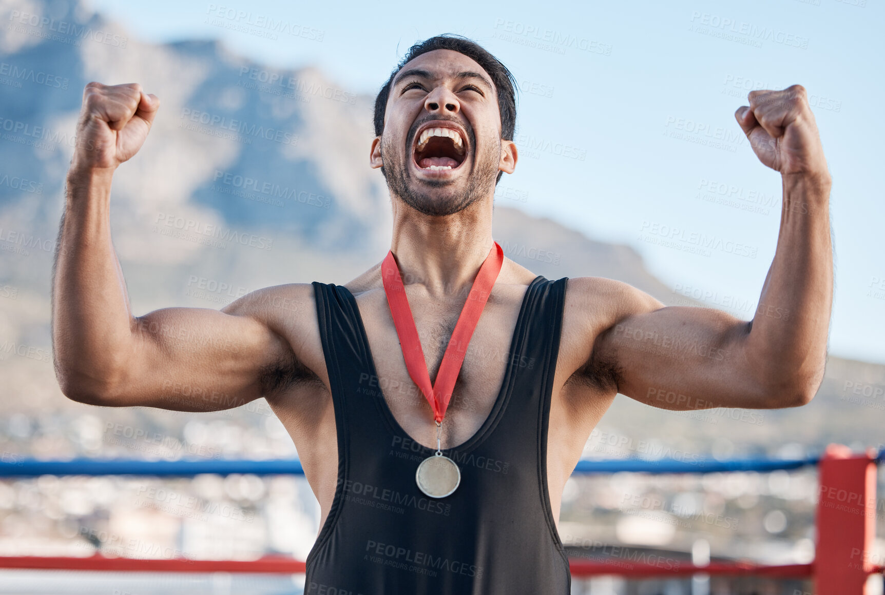 Buy stock photo Winner man, wrestling medal and celebration with scream, success and fist in air for outdoor contest in Cape Town. Young athlete, wrestler and champion with goals, achievement and fight competition