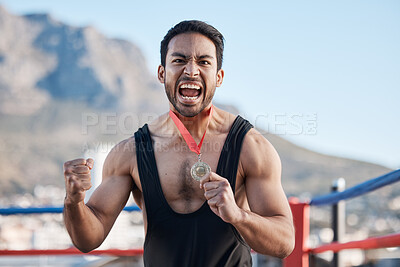 Buy stock photo Champion man, wrestling medal and celebration in portrait, success or fist in air for sports contest on roof in Cape Town. Young athlete, games and winner for goal, achievement and fight competition