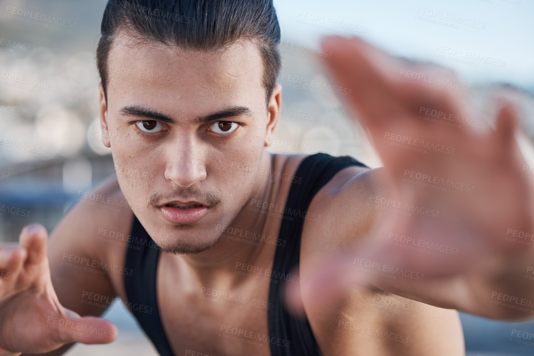Buy stock photo Hands, portrait and a man doing karate in the city, training for taekwondo or sports competition. Serious, fitness and a professional athlete with a move for a workout or martial arts exercise