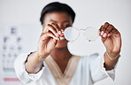 Hands, woman and optician with glasses for vision, eyesight and eye care prescription lens. Closeup of doctor, optometrist and frame for eyewear, test and consulting for optical assessment in clinic