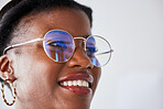 Happiness, glasses and black woman with positive face with vision in studio background with nerd. Style, thinking and geek with girl beauty or happy expression with eye wear or smile and idea.