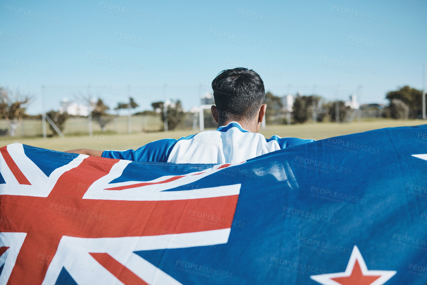 Buy stock photo New Zealand flag, back and sports man with mockup space on blue sky outdoor. Aotearoa banner, national and athlete with patriotism, pride or representation to support country, motivation and sign
