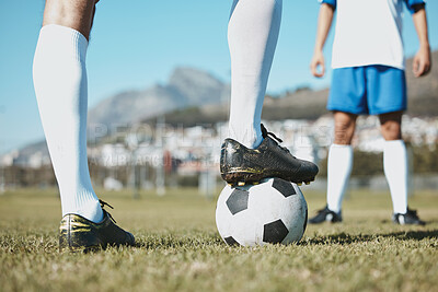 Buy stock photo Soccer, legs and foot on ball for match, game or start on the green grass field in nature outdoors. Feet of sports player on football for competition, beginning or getting ready in sport tournament