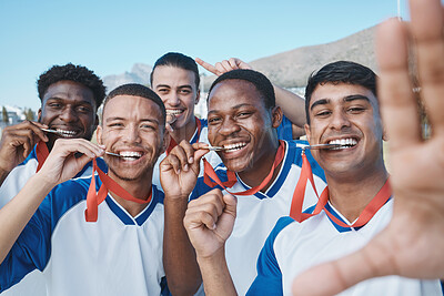 Buy stock photo Men in selfie, medal and winner, soccer competition and sports, athlete group on field, diversity and success. Portrait, young male football player and team with smile in picture, winning and prize