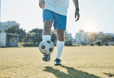 Buy stock photo Training, field and legs of a man with a football for a game, fitness and learning sports. Grass, workout and feet of an athlete for a goal, exercise and playing professional soccer in nature