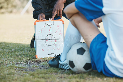 Buy stock photo Hands, soccer team or coach planning a formation with tactics or training strategy on sports field. Board, fitness or closeup of manager teaching football players a game plan for match or workout 