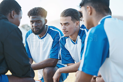 Buy stock photo Sports, huddle and soccer team talking to their coach before a match, training or tournament. Fitness, teamwork and male football player or athletes planning a game strategy at practice on a field.