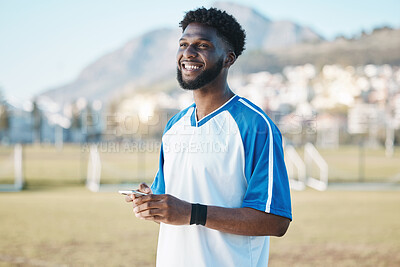 Buy stock photo Fitness, phone or soccer player on field on social media, blog post or texting on internet or online chat. Black man, football or happy African athlete thinking of mobile app in match or sports game