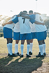 Soccer, support or team in a huddle for motivation, goals or group mission on a field for a sports game. Unity, stadium or football players planning a strategy, exercise or training for fitness match