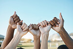 Fist, hands and group with diversity for outdoor celebration or team building together for support, motivation and solidarity. Hand, ready for sport or teamwork with community of people on blue sky