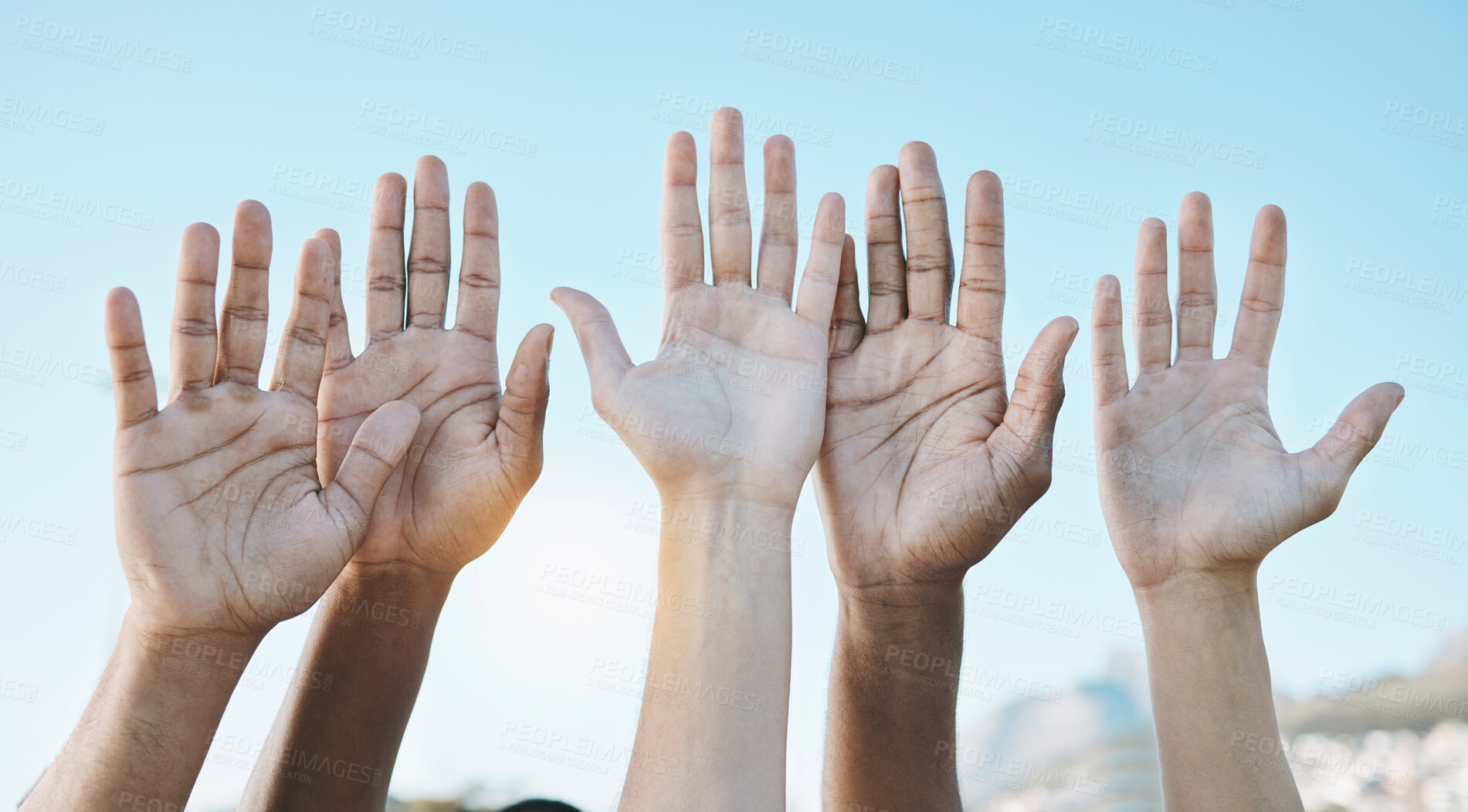 Buy stock photo Diversity, palm of hands and group for outdoor celebration or team building together for support, motivation and solidarity. Raised hand, question or community of people on blue sky background