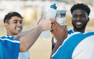 Buy stock photo Success, happy and men in soccer with water bottle after a game, sports win or celebration after training. Smile, drink and athlete people with a toast for achievement, motivation or goal in football