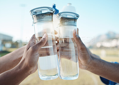 Buy stock photo Fitness, water bottle or hands toast in stadium together after workout, exercise or training game outdoors. Sports target, cheers or closeup of team with liquid for hydration in celebration of goals