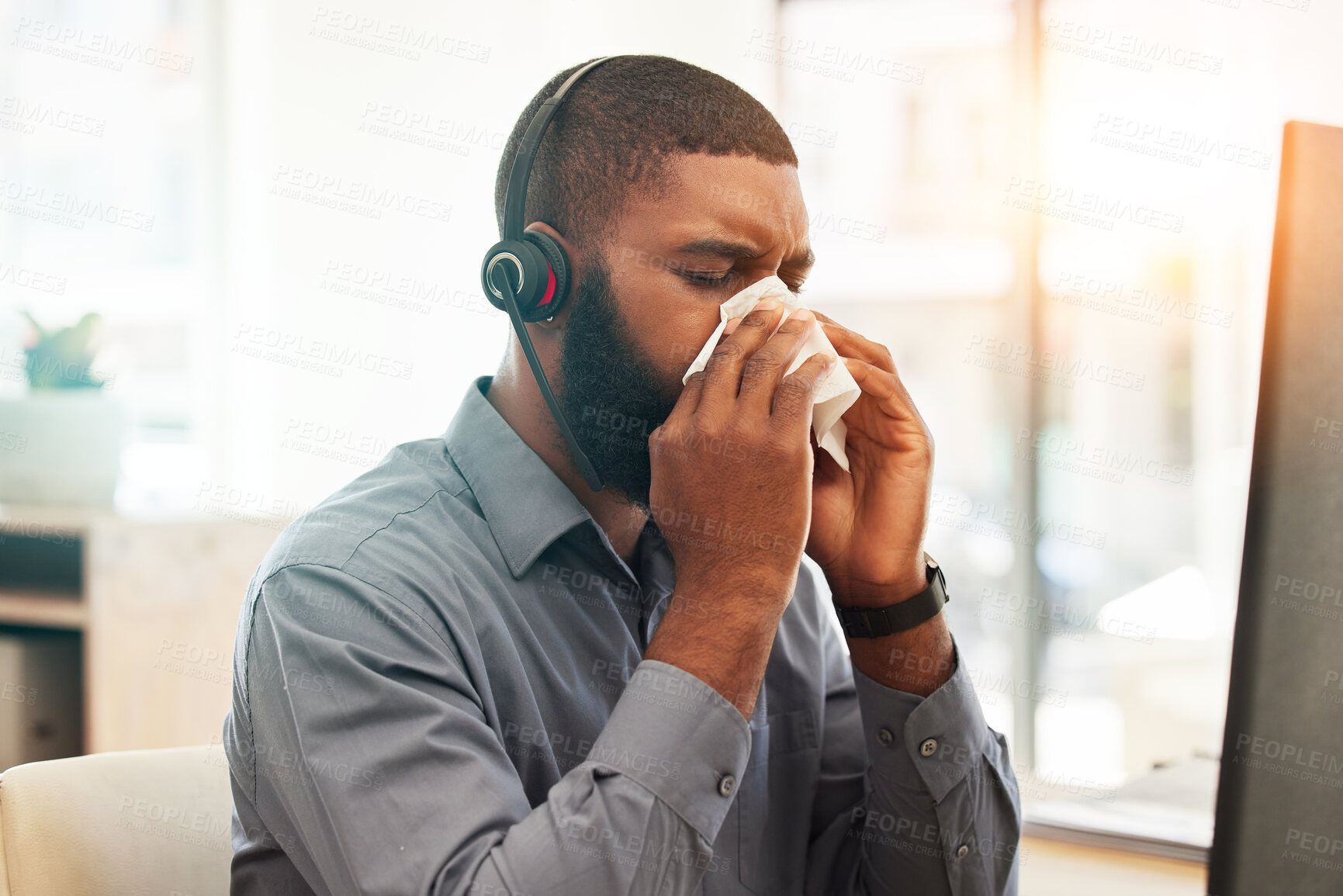 Buy stock photo Call center, sick and black man with a virus, allergy or customer service agent with health issue, illness or bacteria. Male person, employee or consultant with flu, fatigue or allergies in an office