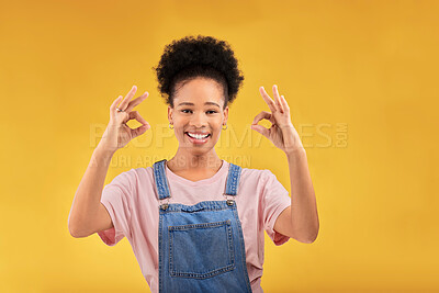 Buy stock photo Portrait, perfect and hand gesture with an excited black woman in studio on a yellow background. Smile, wow and okay with a happy young female person showing a sign of support, feedback or review