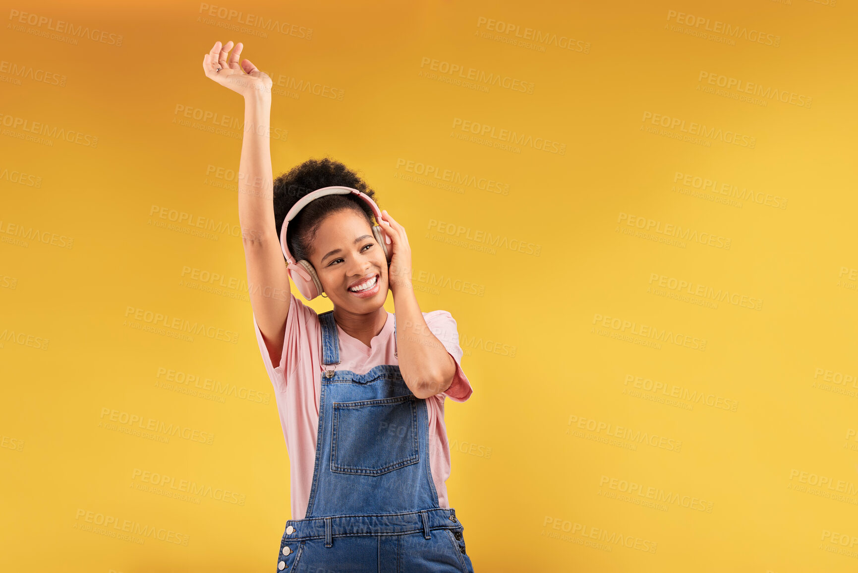 Buy stock photo Headphones, music and happy black woman dance in studio isolated on a yellow background mockup space. African person, smile and listen to radio, podcast or sound for jazz, hip hop or streaming audio