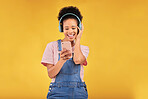 Online, music and a black woman with a phone on a studio background for a podcast or audio. Smile, space and an African girl with headphones and a mobile for an app, streaming and listening to radio