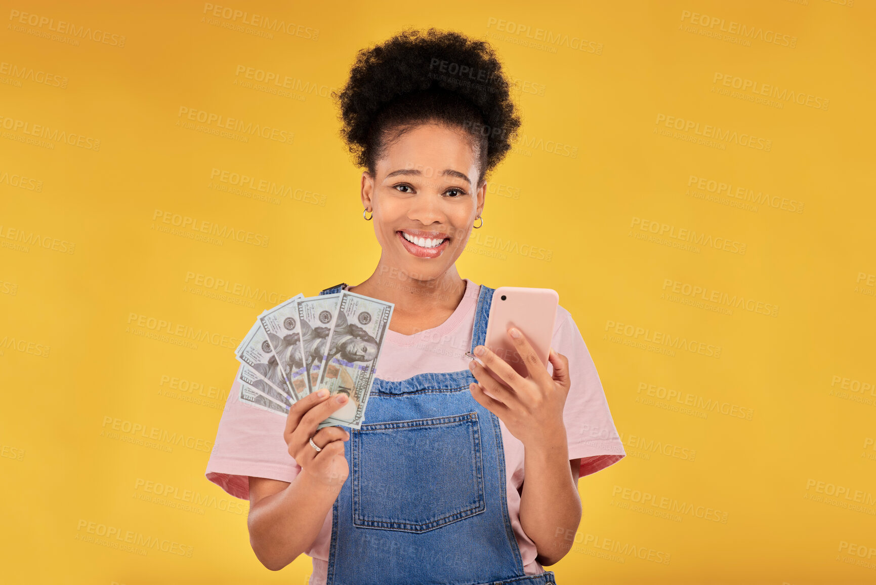 Buy stock photo Phone, money and winner with portrait of black woman in studio for success, prize or online payment. Bonus, lottery and fintech with person and cash on yellow background for dollar, sale or giveaway