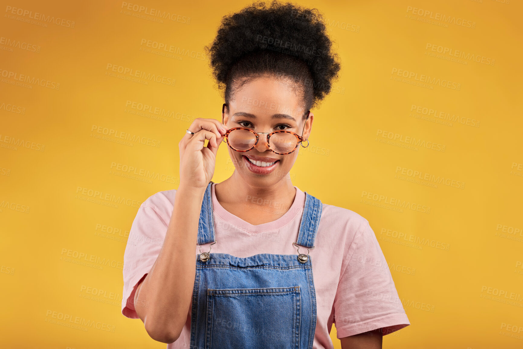 Buy stock photo Portrait, glasses and happy with a black woman on a yellow background in studio for vision. Fashion, eyewear and smile with a young afro female nerd at the optometrist for prescription frame lenses